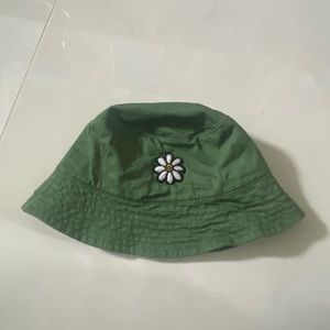 green bucket hat with daisy flower patch